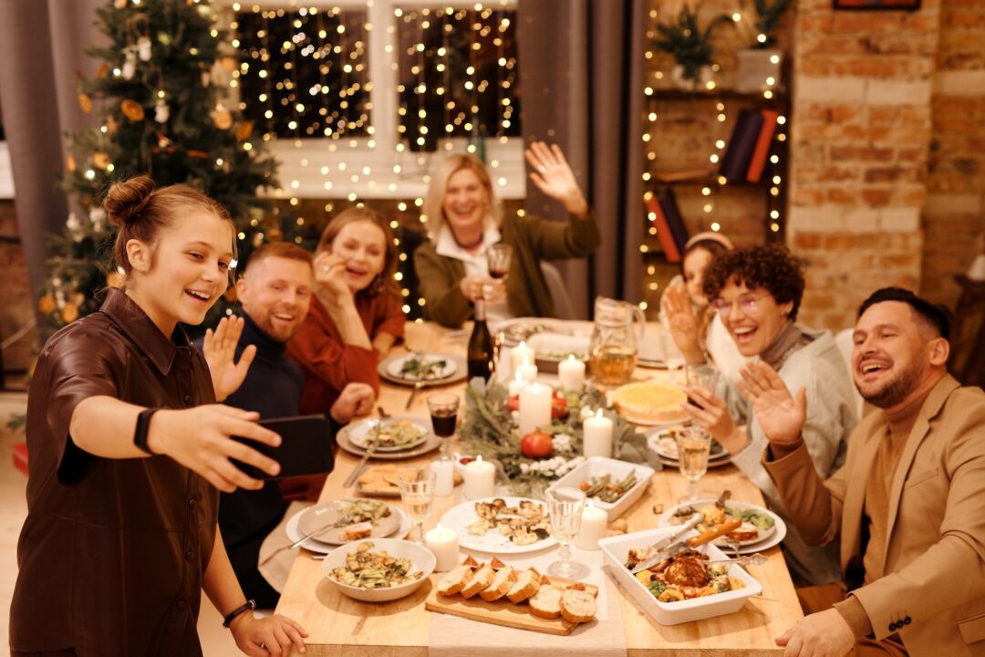 blended family taking a selfie during Christmas meal